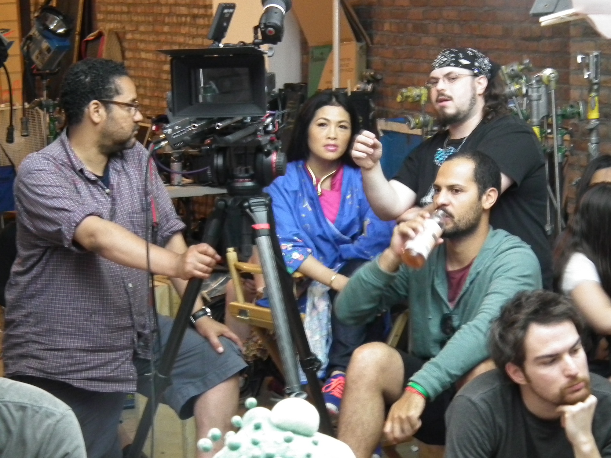 Grace Chang seated by the camera during a studio shoot