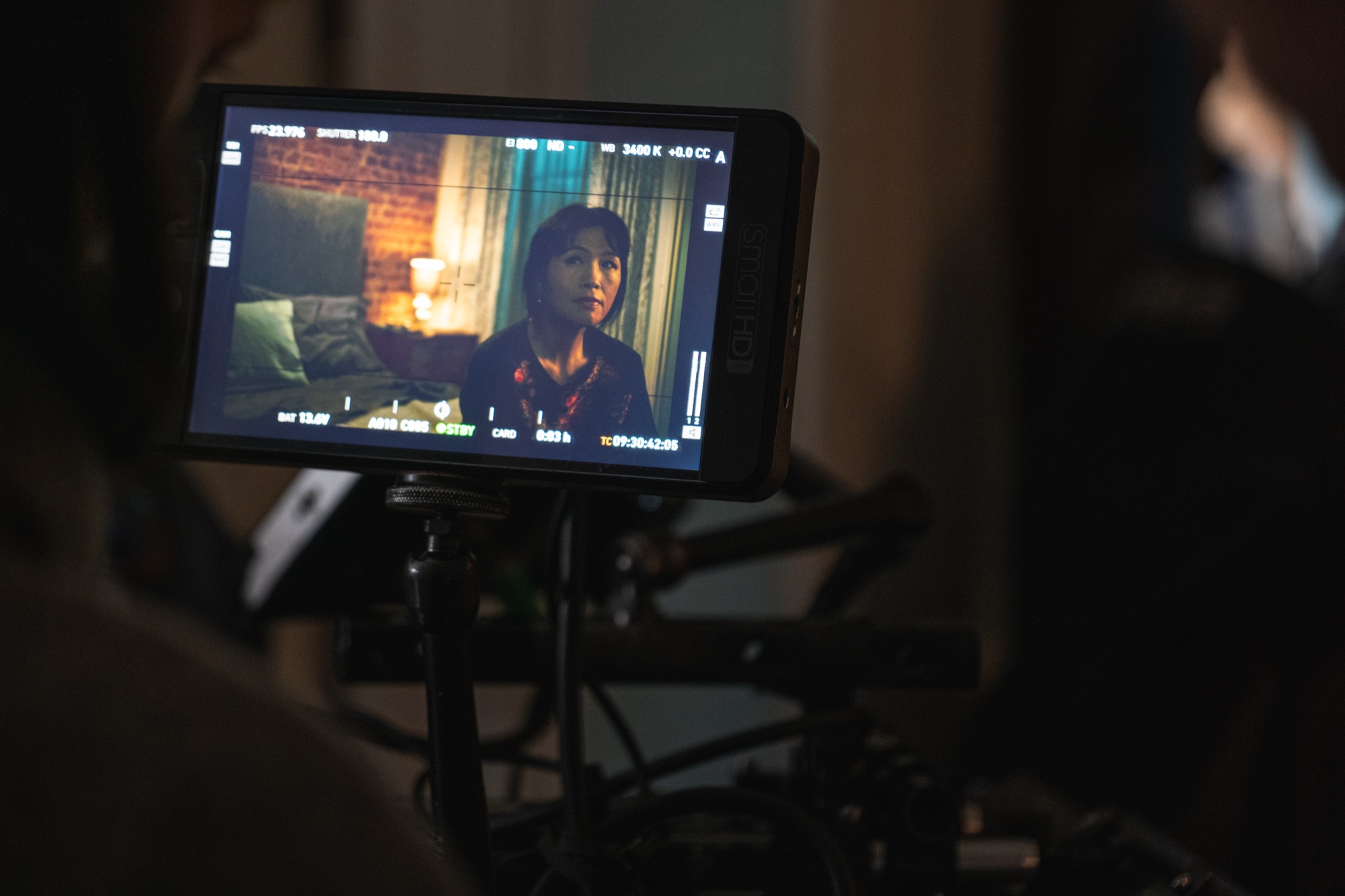 Director's monitor on set showing Grace Chang in frame