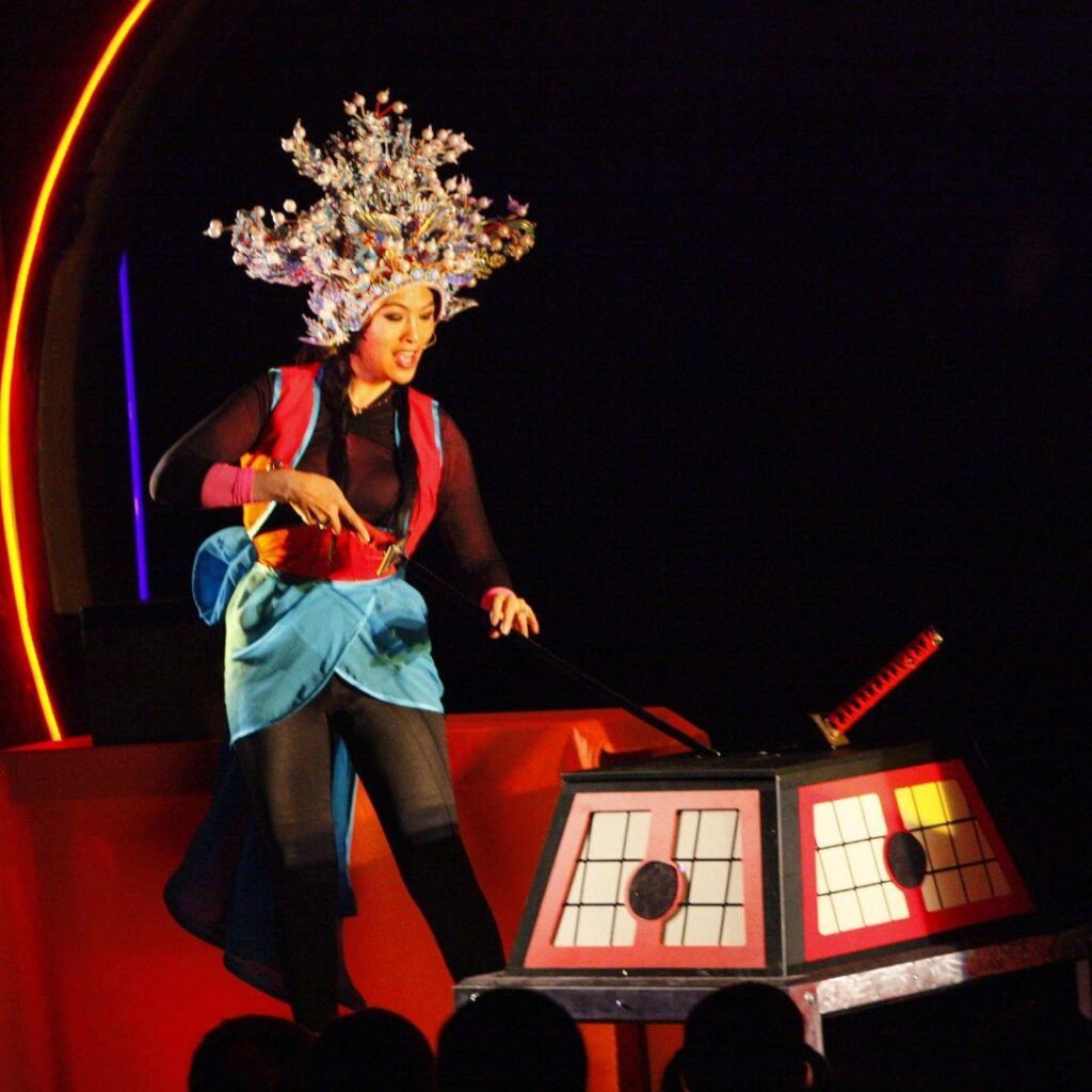 Grace Chang in traditional Chinese opera costume on stage