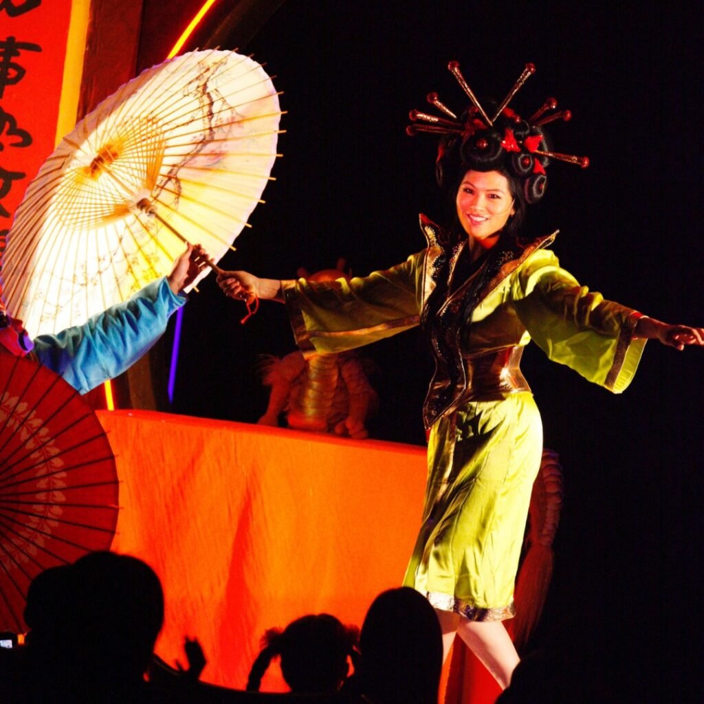 Grace Chang performing traditional Chinese stage art with umbrella