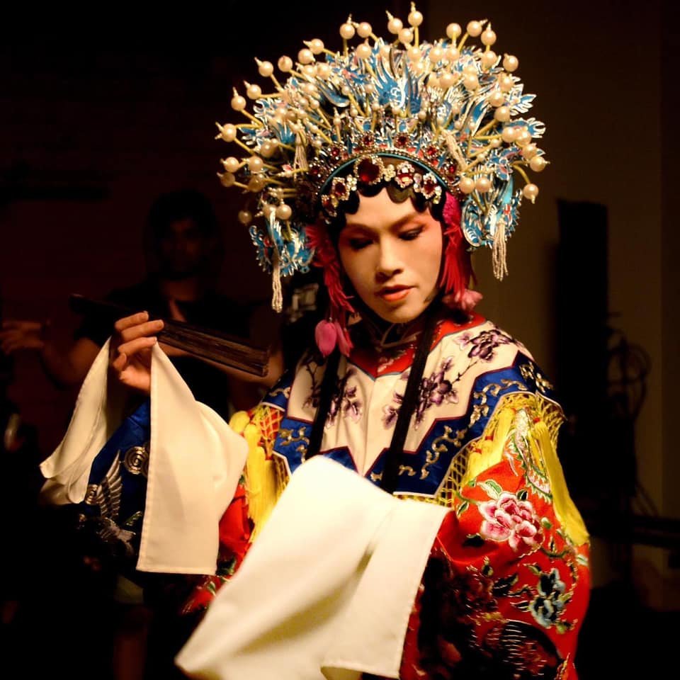Grace Chang behind the scenes outdoors with performance costume